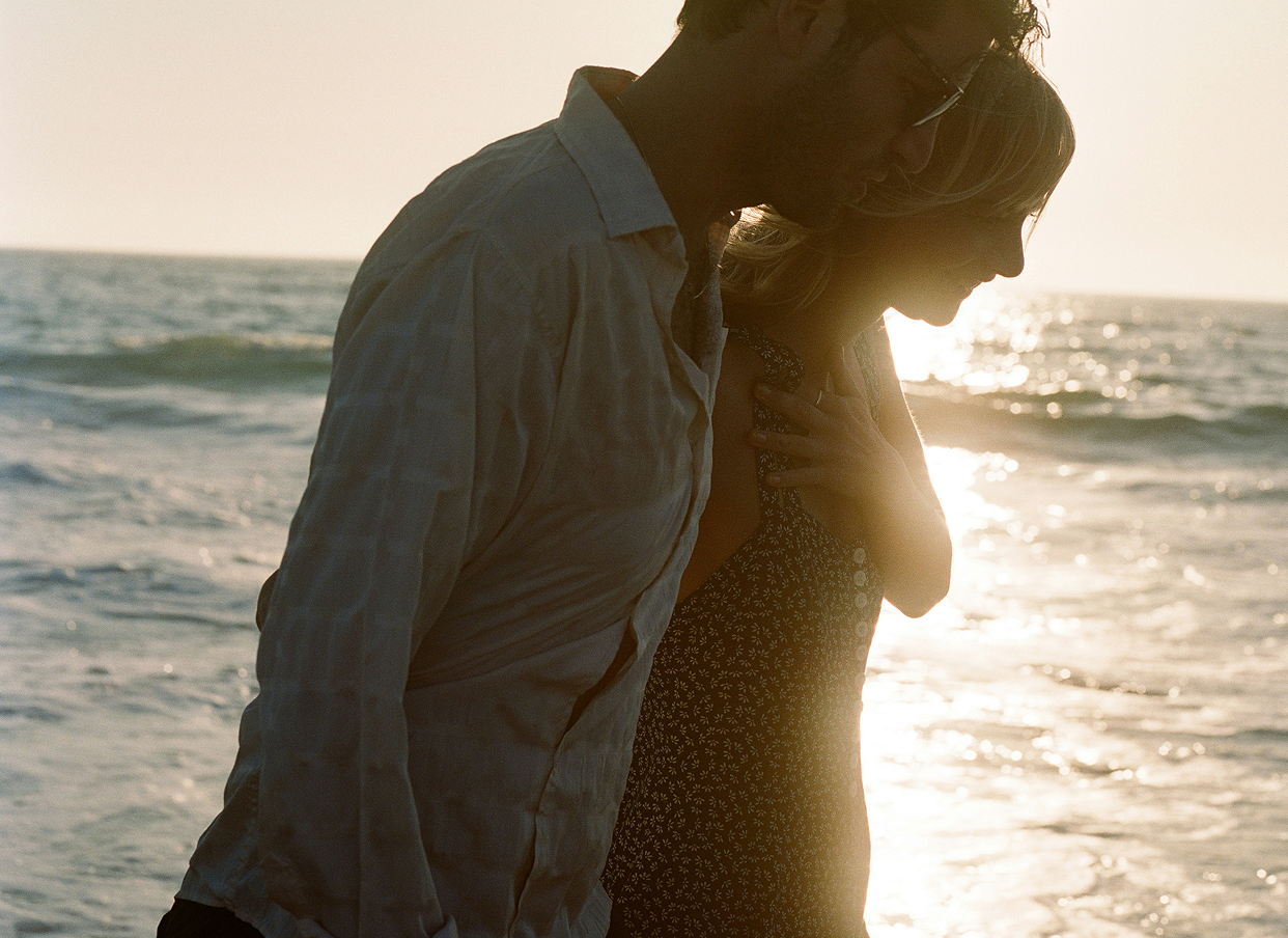 Couple together on a beach, representing love life